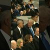 Trump and Obama are seen talking before Jimmy Carter’s funeral